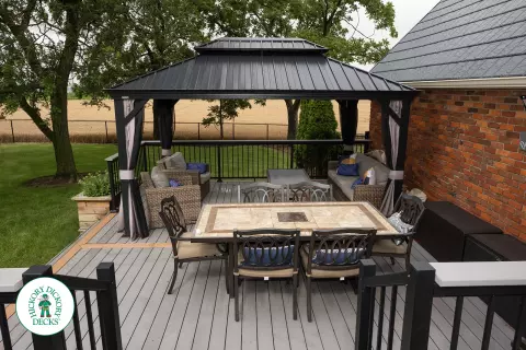 Grey TruNorth deck with brown borders and aluminum railing.