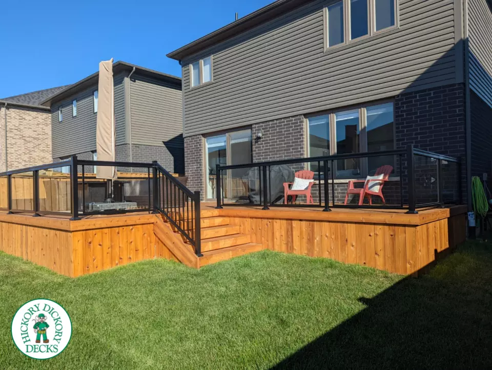 Large cedar deck with stairs, aluminum railing
