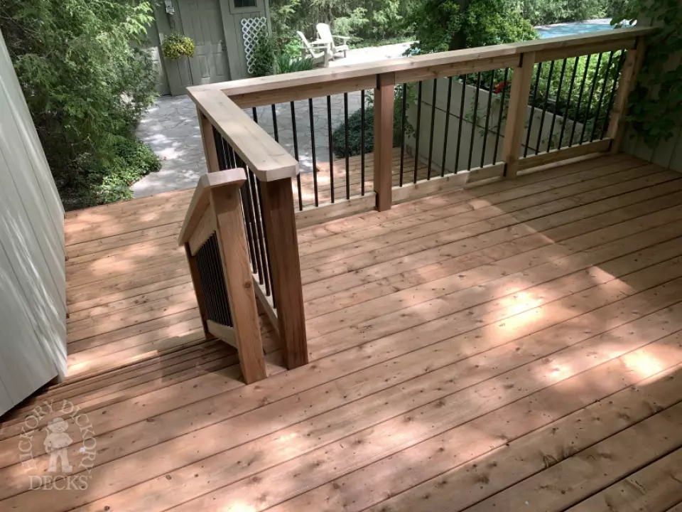 2 level pressure treated deck with picket railings.