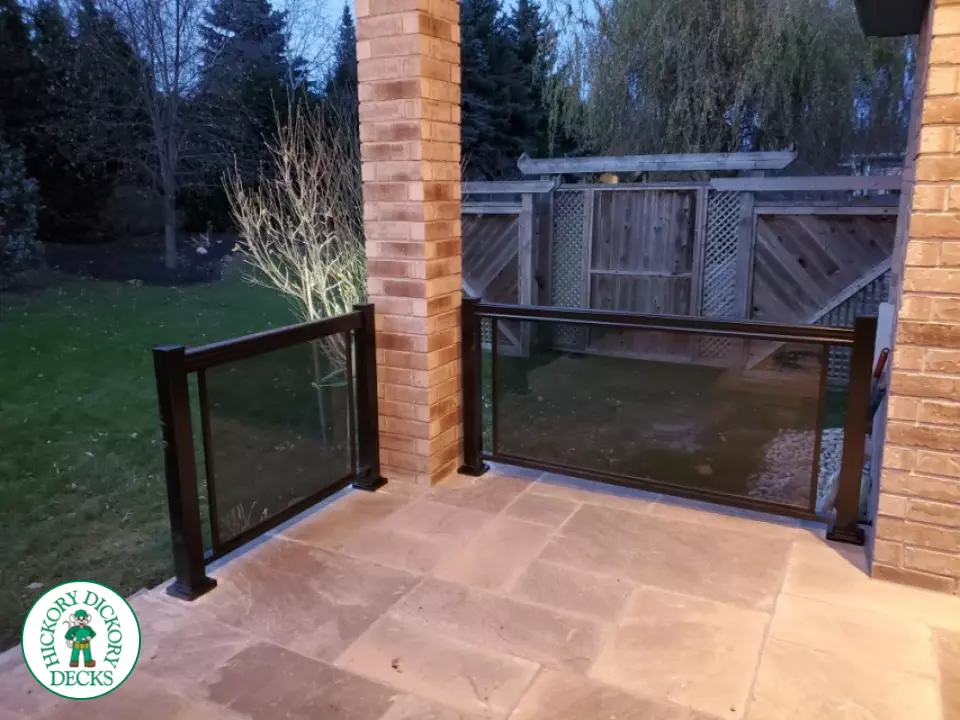 Glass railing that has a black tint.