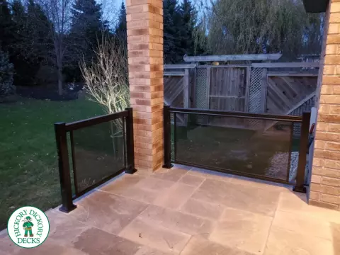 Glass railing that has a black tint.
