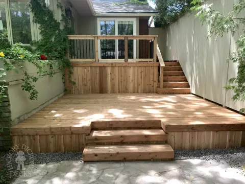 2 level pressure treated deck with picket railings.