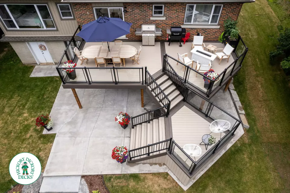 Clubhouse multi level deck with glass railings and lights in Cambridge