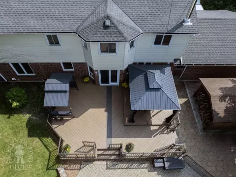 Clubhouse deck with aluminum railing with gate insert for access.