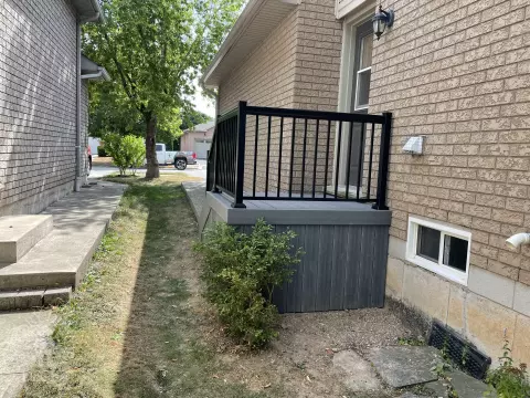 Small porch and deck built in dark grey clubhouse