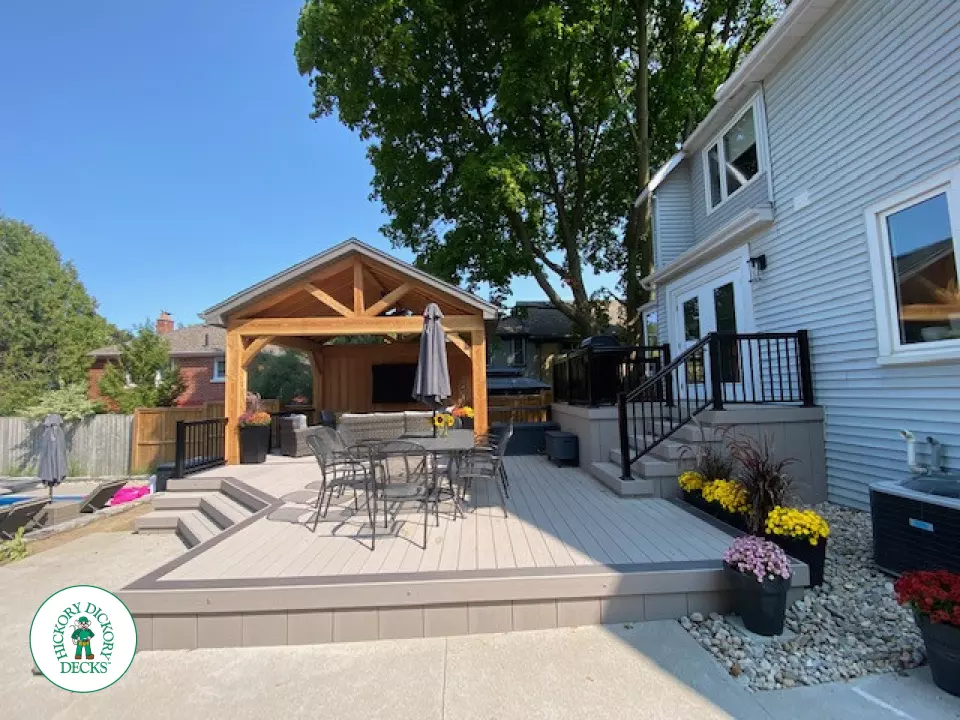 Large Azek deck with unique stairs and a cedar pavilion for shade.