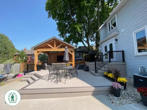 Large Azek deck with unique stairs and a cedar pavilion for shade.