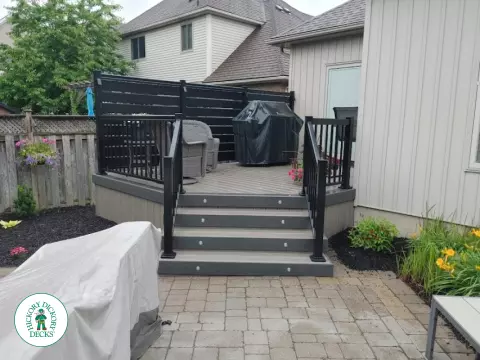 Clubhouse deck with privacy screens and lights in St. Catharines