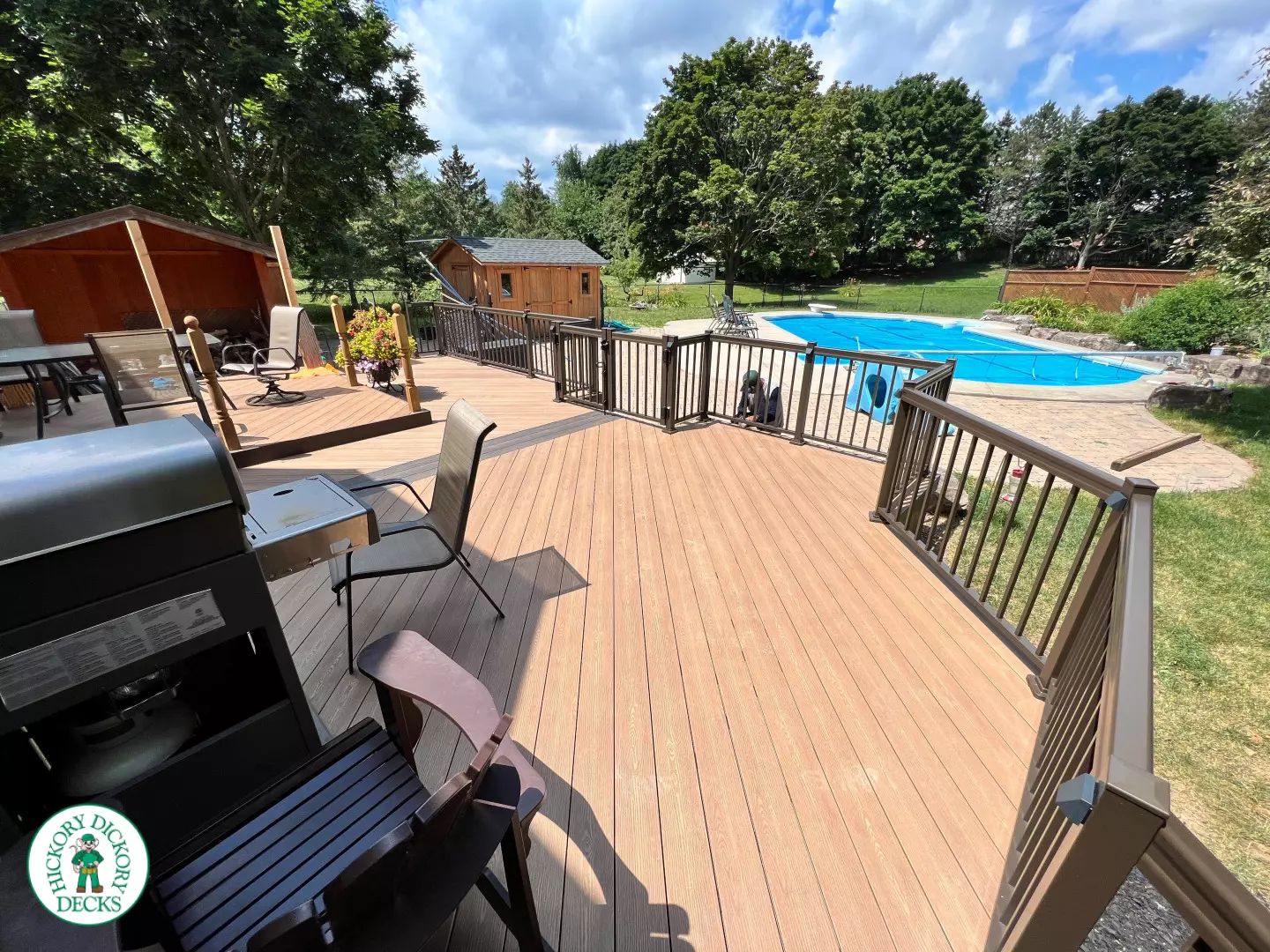 Clubhouse deck with aluminum railing with gate insert for access.