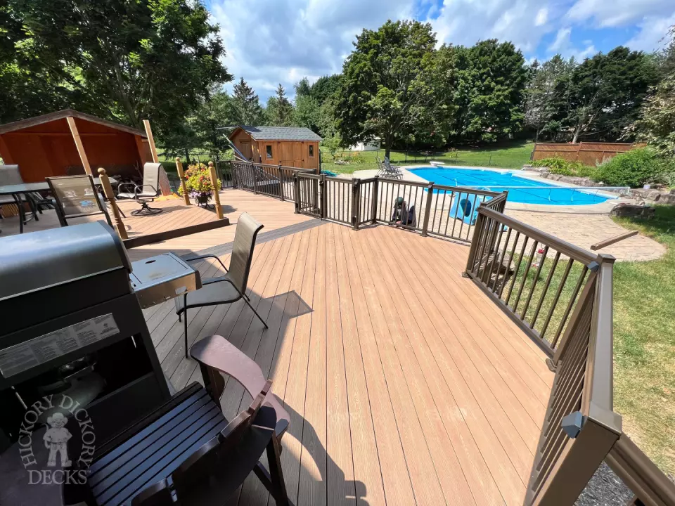 Clubhouse deck with aluminum railing with gate insert for access.