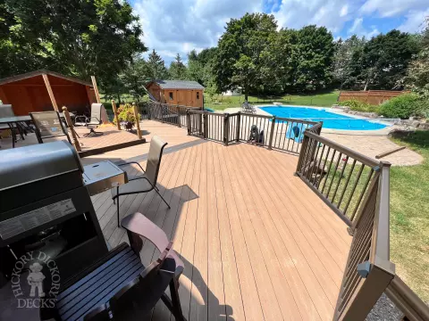 Clubhouse deck with aluminum railing with gate insert for access.