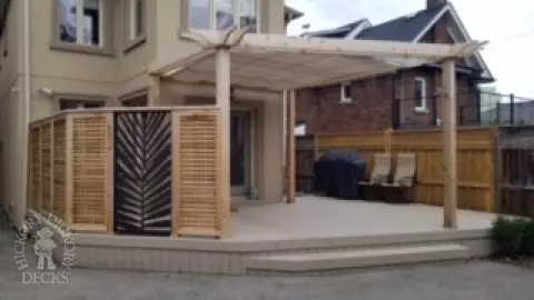 Custom cedar privacy screen with fun design.