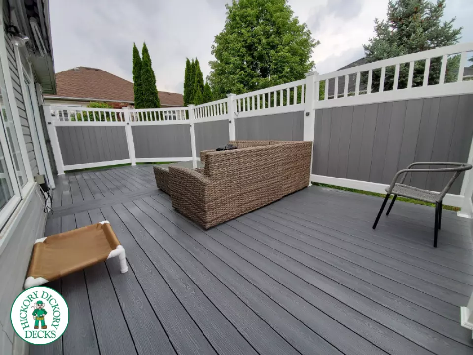 Private grey walk out deck with grey privacy screen all around