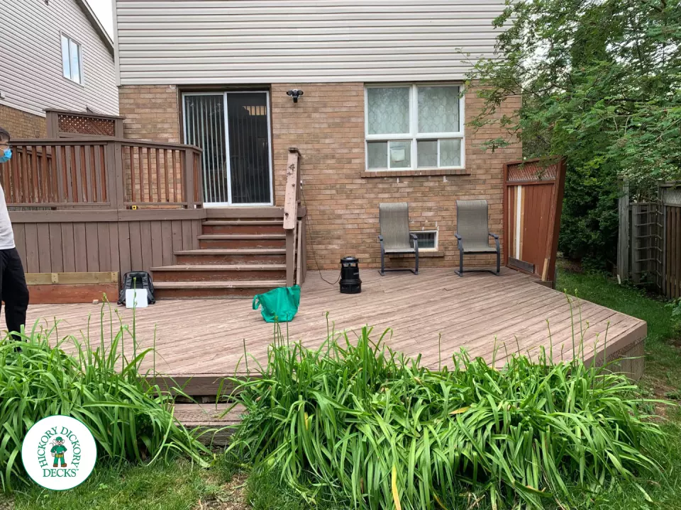 Veka modern deck in Mississauga with glass rails and stairs