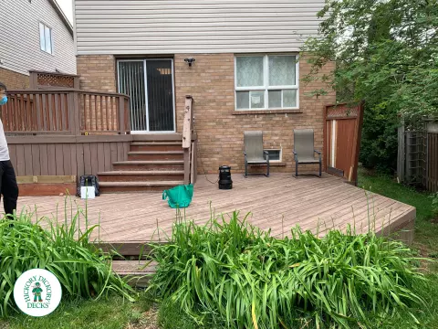 Veka modern deck in Mississauga with glass rails and stairs