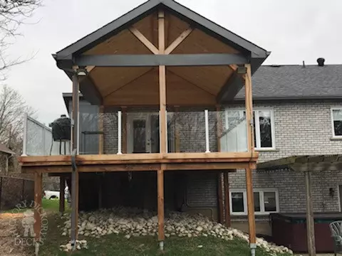 High cedar deck with glass railings High cedar deck with glass railings