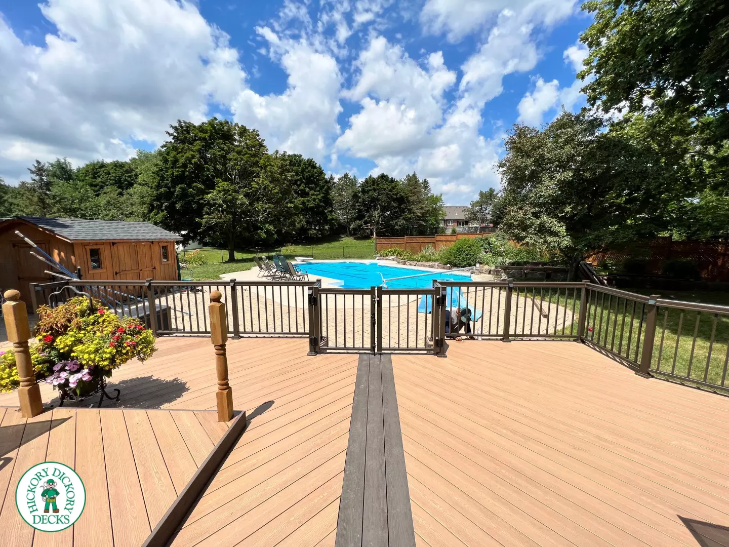 Clubhouse deck with aluminum railing with gate insert for access.