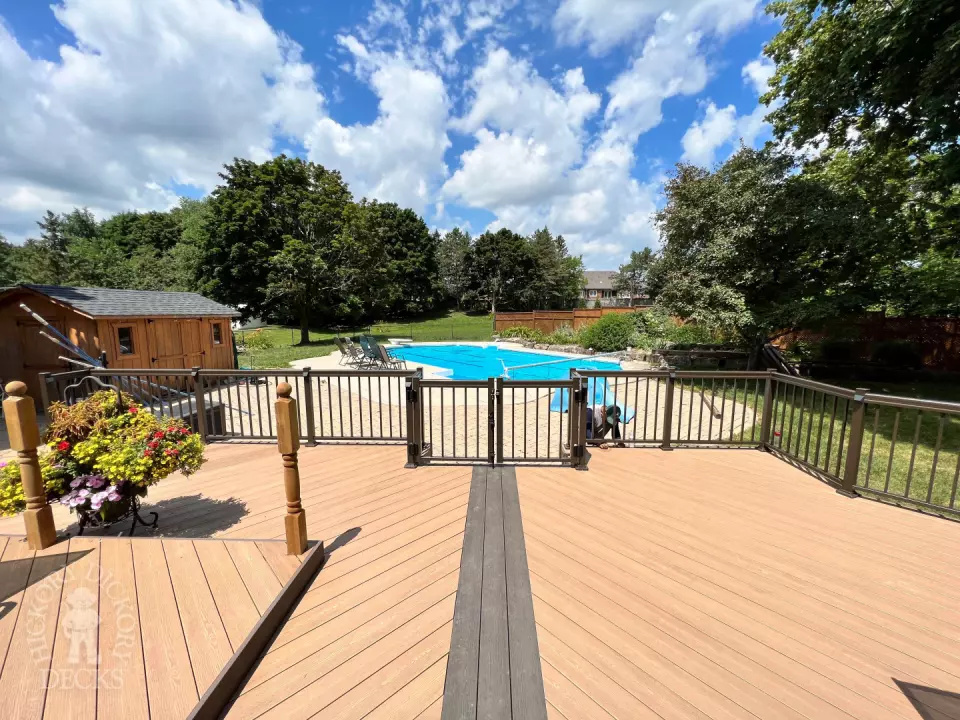 Clubhouse deck with aluminum railing with gate insert for access.