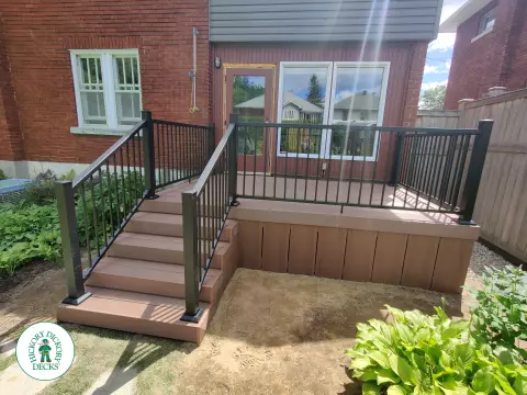 Small brown fiberon deck with black aluminum railing.