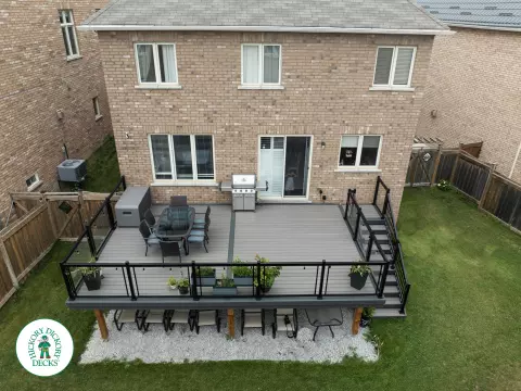 Elevated trex deck with glass railings and stairs in Brampton Elevated trex deck with glass railings and stairs in Brampton