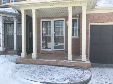 Small light brown front porch  with dark brown trim