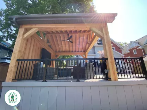 Large Azek deck with unique stairs and a cedar pavilion for shade.