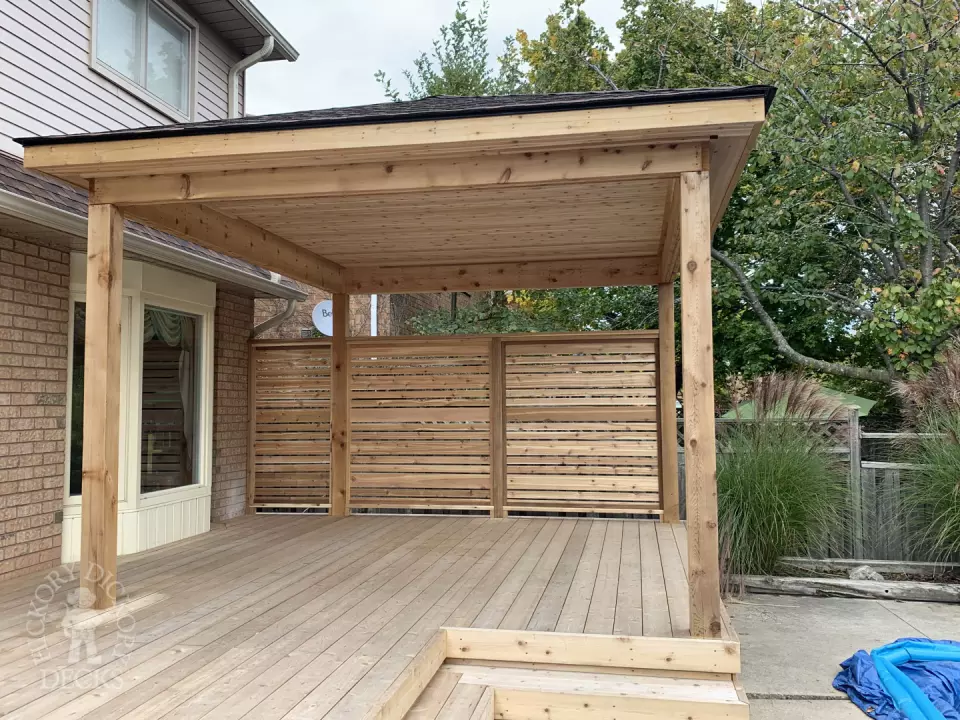 Cedar deck with privacy screens and pavilion in Oakville