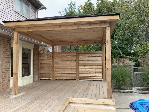 Cedar deck with privacy screens and pavilion in Oakville