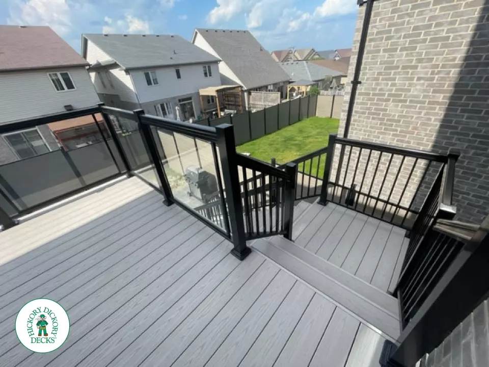 High grey composite deck with glass style railings.