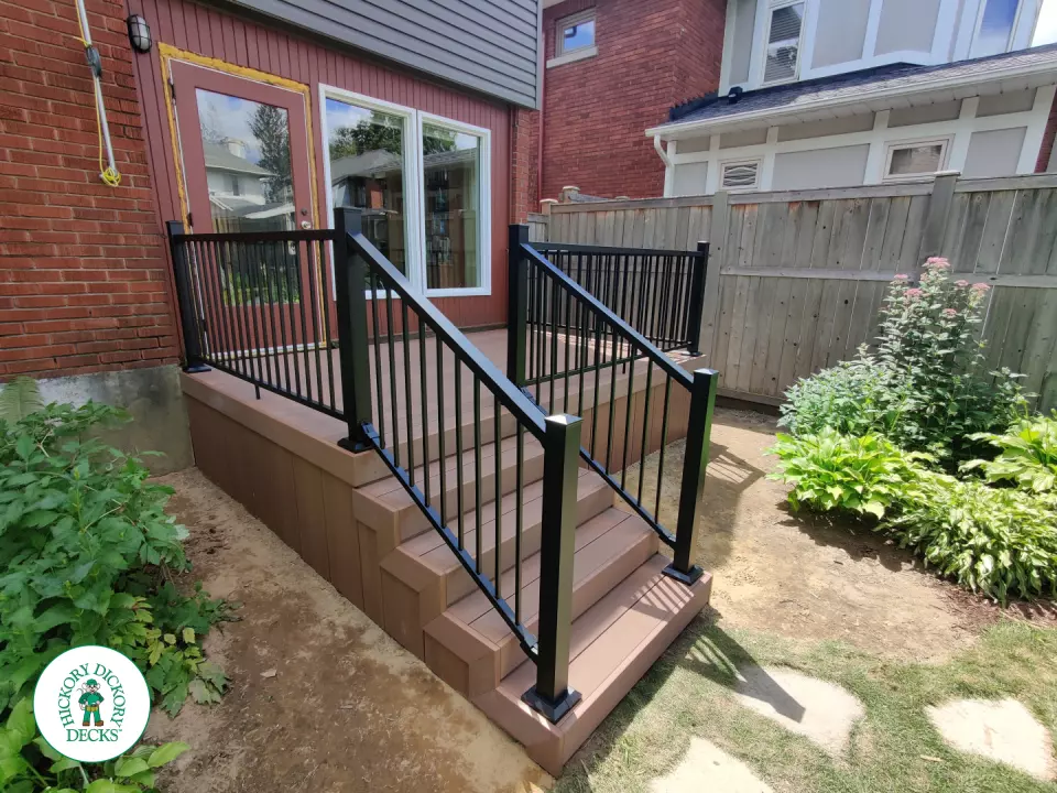 Small brown fiberon deck with black aluminum railing.