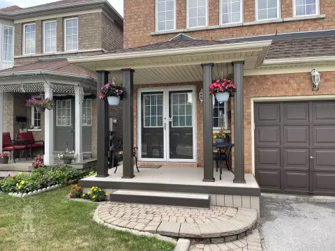 Small light brown front porch  with dark brown trim