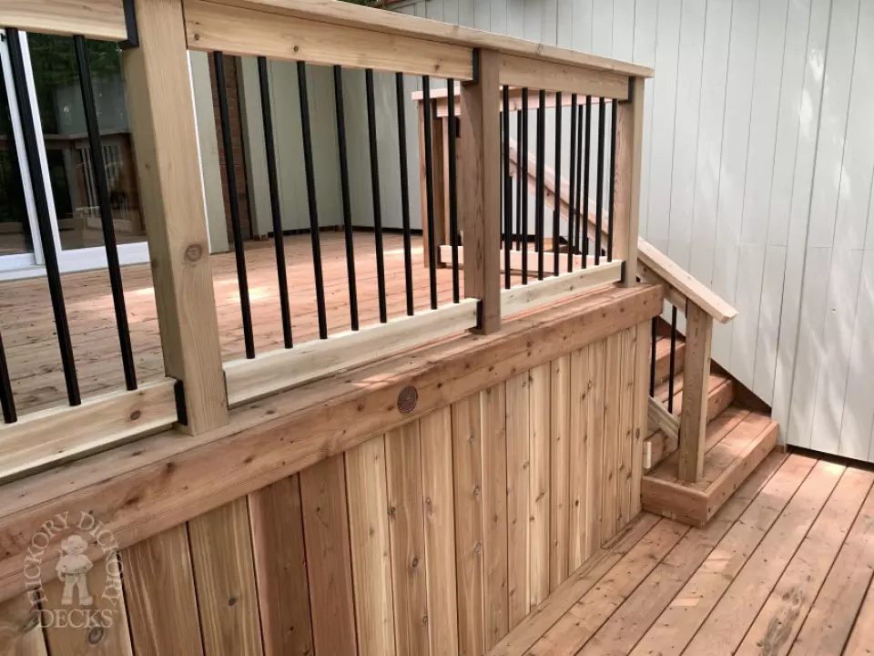 2 level pressure treated deck with picket railings.