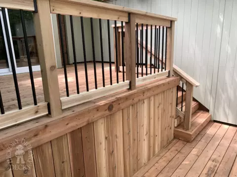 2 level pressure treated deck with picket railings.