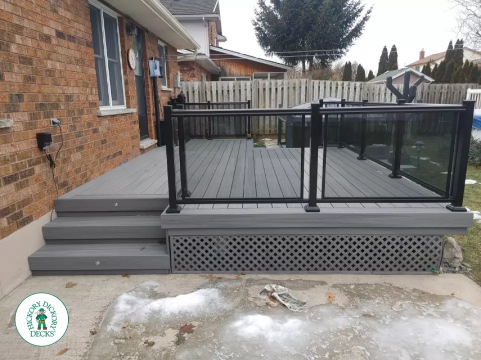 Fiberon low deck with glass railings in Welland