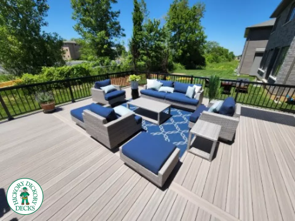 Large grey fiberon walk out deck with black aluminum railings