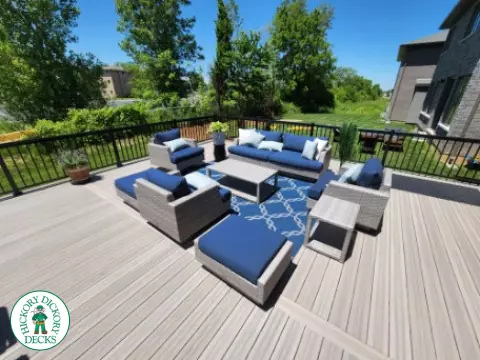 Large grey fiberon walk out deck with black aluminum railings