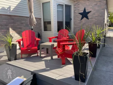 Small grey azek walk out deck with lighting in stairs