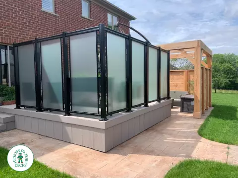 Slate grey Azek deck with large privacy screens, a pergola and aluminum rails, Kitchener, Ontario