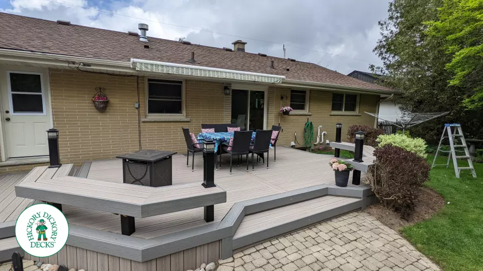 Low to ground grey deck with custom benches