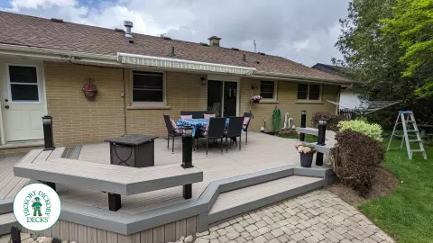 Low to ground grey deck with custom benches