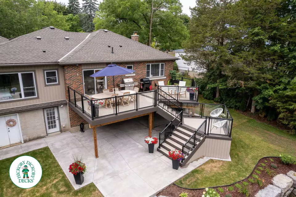 Clubhouse multi level deck with glass railings and lights in Cambridge