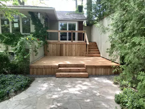 2 level pressure treated deck with picket railings.