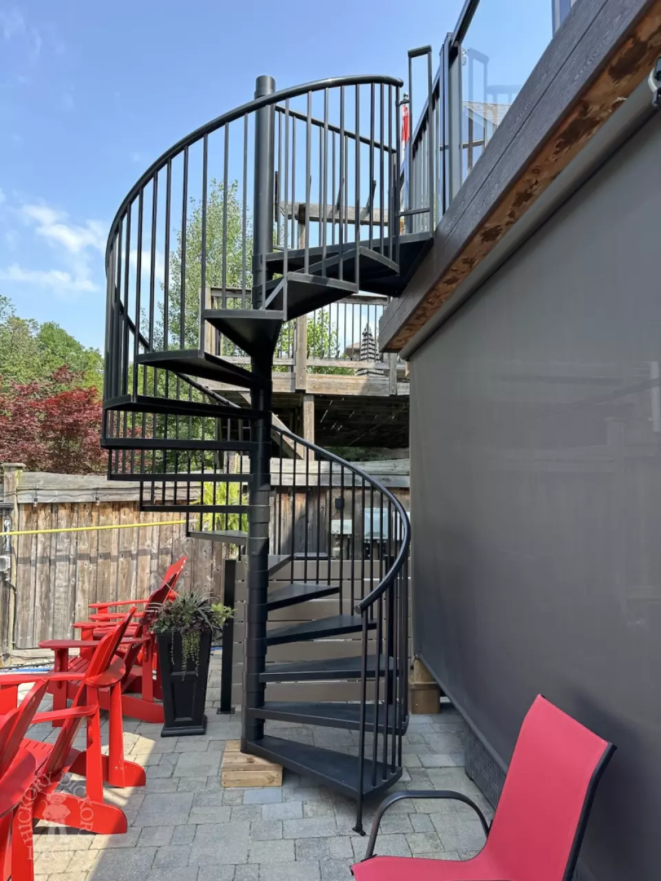 Clubhouse high deck with glass rail and spiral staircase in Newmarket