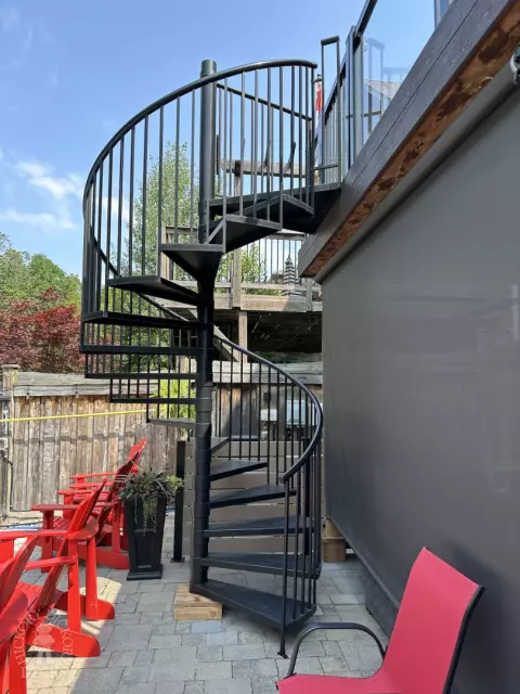 Clubhouse high deck with glass rail and spiral staircase in Newmarket