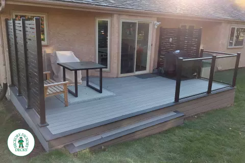Timbertech deck in Calgary with privacy and glass rail
