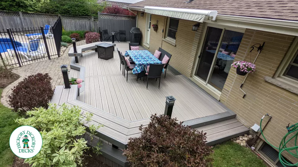 Low to ground grey deck with custom benches