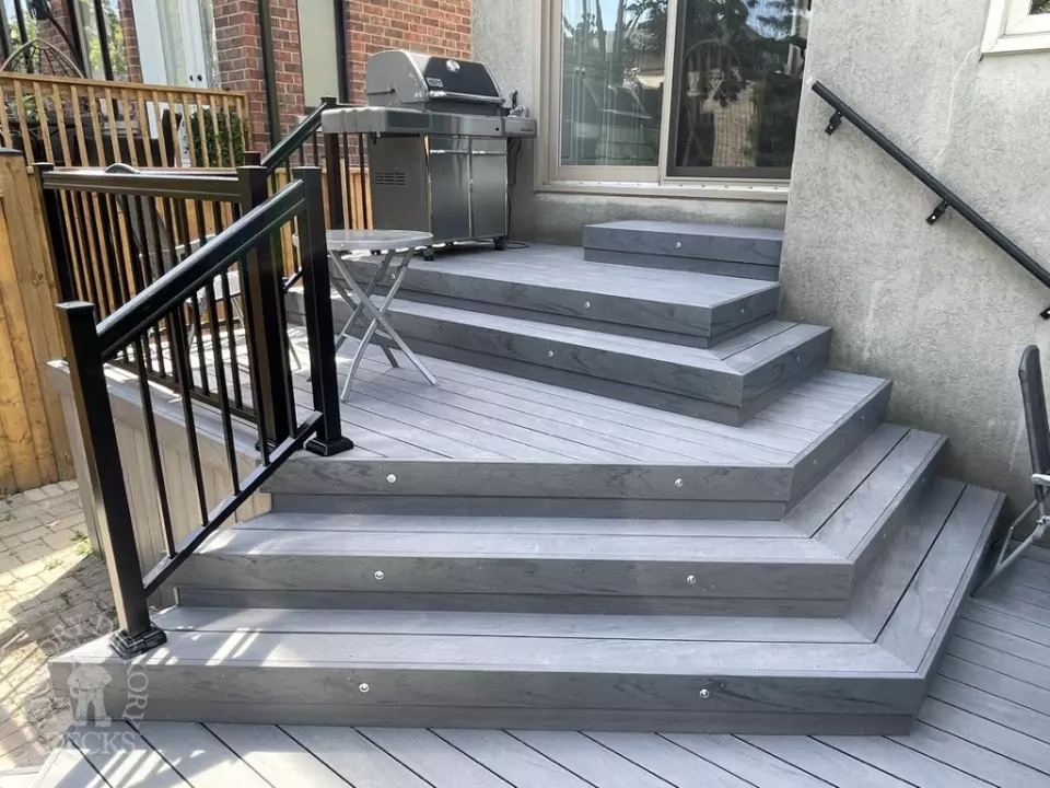 Small multilevel grey deck with lights in steps