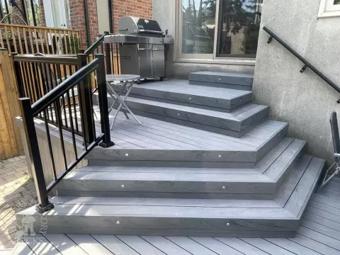 Small multilevel grey deck with lights in steps