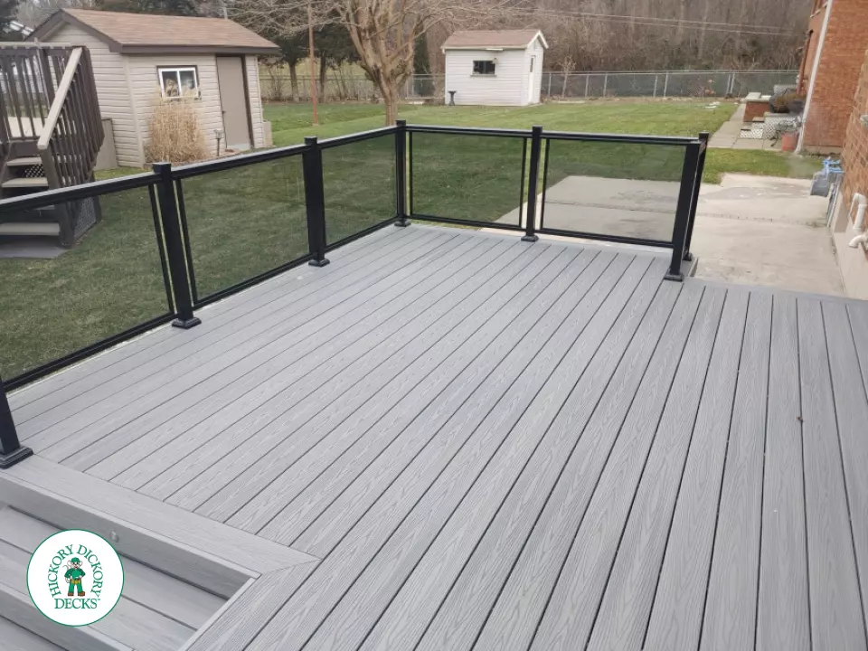 Fiberon low deck with glass railings in Welland