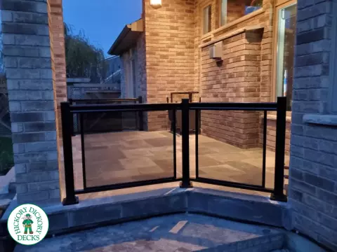Glass railing that has a black tint.